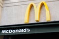 M yellow mcdonald logo and sign on building wall of mcdonalds restaurant fast food