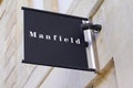 Manfield logo and text sign of store footwear boutique shop shoes retailer
