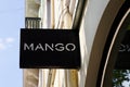 Mango clothing store logo brand shop front entrance text sign in street