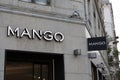 mango logo brand and text sign on wall facade shop entrance in city