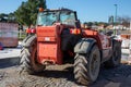 Manitou logo brand and text sign on red tractor rental forklift Handler industrial