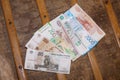 Many russian money banknotes of russia roubles on wooden table background