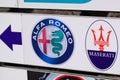 maserati and Alfa Romeo car logo sign shop store Italian brand automobiles