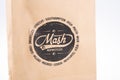 Mash sign text and brand logo brown cardboard bag dealership motorcycles store