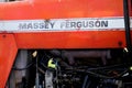 Massey Ferguson Tractor logo brand and text sign on ancient vintage industrial vehicle