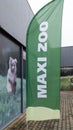 Maxi zoo flag facade logo brand and text sign on pet store and animal accessories shop