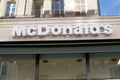Mc donald logo and text sign of fastfood restaurant Mc Donalds