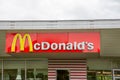 McDonald`s sign m logo sign and text brand on Restaurant facade Exterior of McDonalds Royalty Free Stock Photo