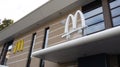 McDonald`s sign text and brand logo on Restaurant facade of McDonalds fast food Royalty Free Stock Photo