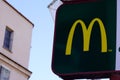 McDonalds logo and text m sign of global chain of fast food restaurant store Royalty Free Stock Photo