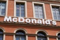 Mcdonalds sign text and logo brand front of fast food mcdonald`s restaurant building Royalty Free Stock Photo