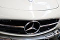 Mercedes benz car star sign logo front of old vintage ancient car Royalty Free Stock Photo