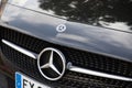 mercedes-benz logo brand and text sign front new mercedes star modern car