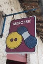 mercerie french text means store haberdashery sign shop on wall facade