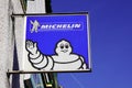 Michelin bibendum logo sign and text of french tire manufacturer front of station car