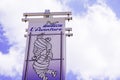 Michelin l`aventure bibendum logo sign and text on flag front of corporate museum