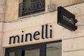 minelli logo brand and text sign on wall facade storefront fashion business