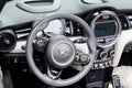 Mini car front interior steering wheel dashboard inside convertible seats of cooper Royalty Free Stock Photo