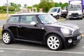 mini car model black and white wheels in side street view in city Royalty Free Stock Photo