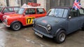 Mini cooper exhibition ancient car logo brand and text sign wings front of racing