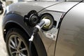 Mini E electric car in charger modern hybrid vehicle