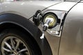 Mini E electric car charging detail in side charger modern hybrid vehicle Royalty Free Stock Photo
