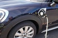 Mini e electric car charging plug EV charge of modern vehicle Royalty Free Stock Photo