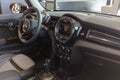 Mini e electric car front interior steering wheel dashboard inside leather seats of