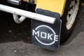 Mini Moke car mudflap beach buggy by Austin mini utility vehicle sign brand and logo Royalty Free Stock Photo
