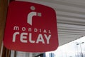 Mondial Relay delivery red shop sign text and brand logo on wall partner store for the