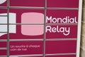 Mondial Relay sign brand and text logo store front of delivery parcel post