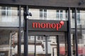 Monop\' logo brand and text sign on new store building supermarket facade entrance sho