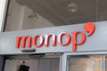 Monop` logo sign and text brand on city building of supermarket facade in town street