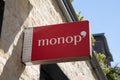 Monop\' logo sign and text brand on city building of supermarket facade in town street