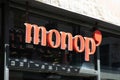 Monop sign text and brand logo facade entrance store chain of town shop in city center
