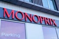 Monoprix logo brand and red sign text of city shop supermarket store facade