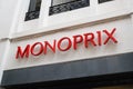 Monoprix logo brand and red sign text on wall entrance city shop supermarket store