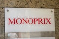 Monoprix logo sign shop facade wall supermarket store entrance text brand city market
