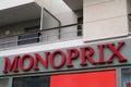 Monoprix logo sign shop supermarket store wall facade text brand