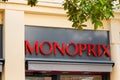 Monoprix logo and text sign of shop supermarket store facade in street