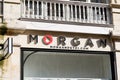 Morgan sign brand and text logo front of fashion store facade main street