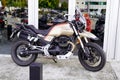 Moto Guzzi v85 tt motorcycle front of bike dealer motorbike seller windows shop of