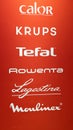 Moulinex calor krups tefal rowenta lagostina brand sign and logo text front of wall