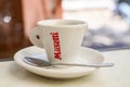 Musetti logo brand and text sign on cup coffee