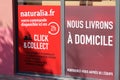 Naturalia brand sign an logo text panel click and collect French distribution chain