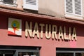 Naturalia logo brand and sign text on wall facade store entrance biological shop
