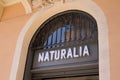 Naturalia logo brand and text sign on store front biological shop distribution of food