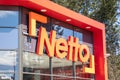 Netto logo brand and text sign on wall facade market discount store entrance