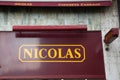 Nicolas logo brand and text sign wall chain facade shop of French wine alcohol
