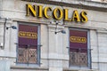 nicolas text brand facade entrance cave alcohol shop cellar sell wine beer store logo